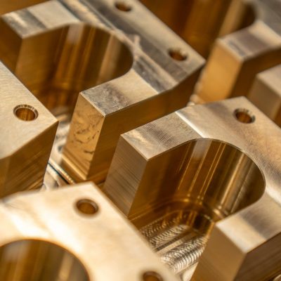 Detailed close-up of machined metal components in an industrial setting.